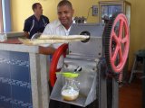 Squeezing the juice from sugar cane for drinks